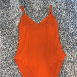 Orange body suit